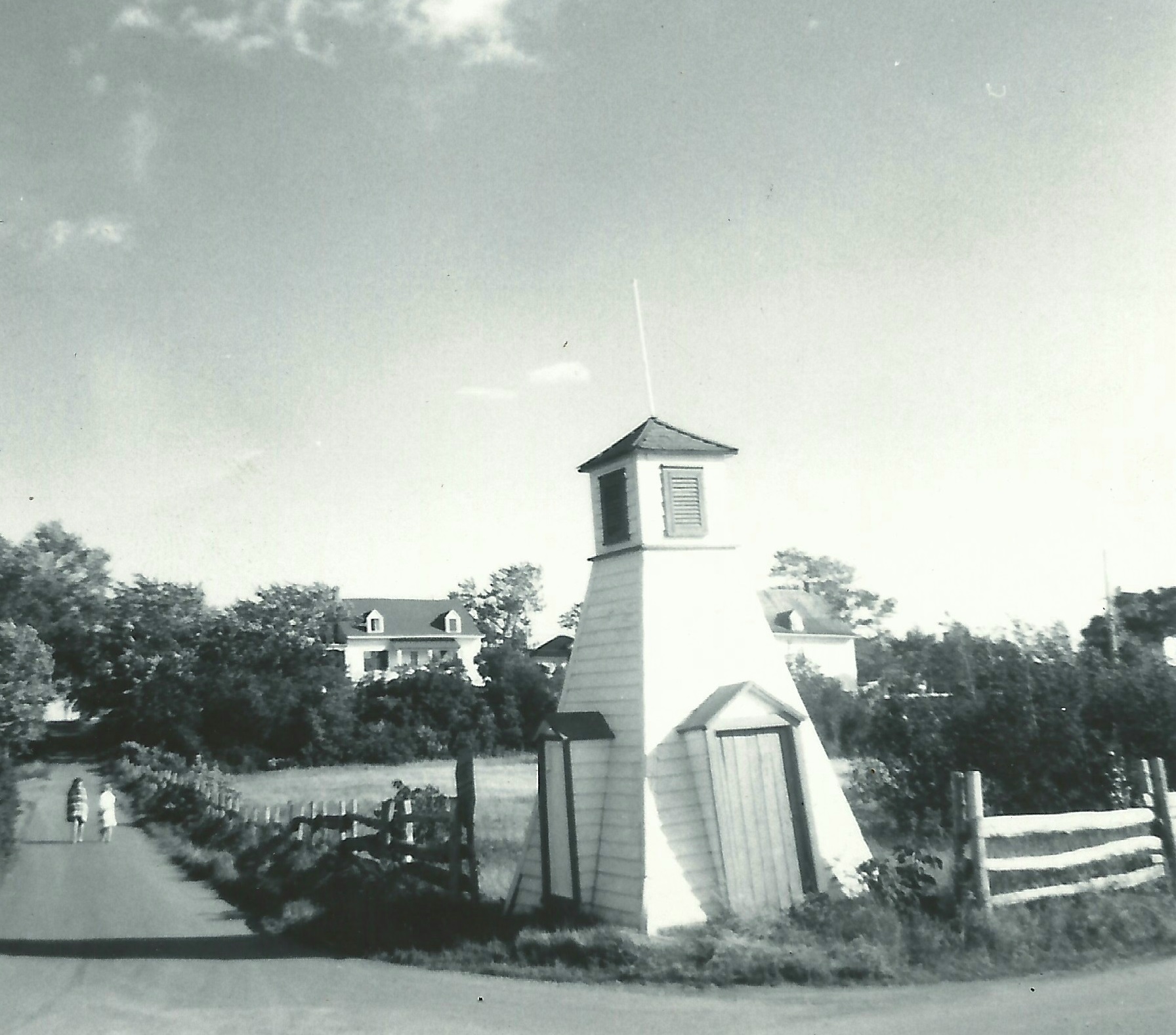 A photograph shows a changing-cabin on the lower part of a slope where two roads meet.