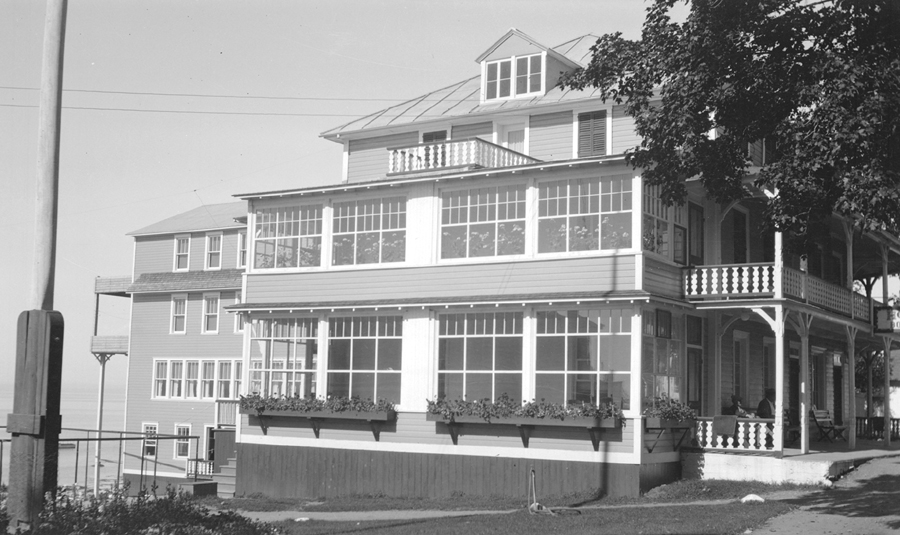 A hotel with many large windows.