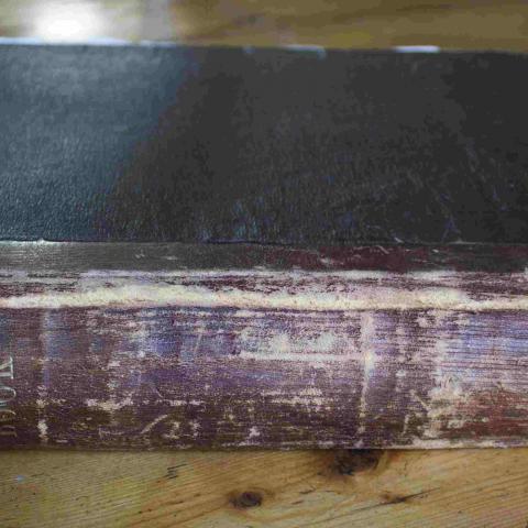 Photograph of an old book binding.