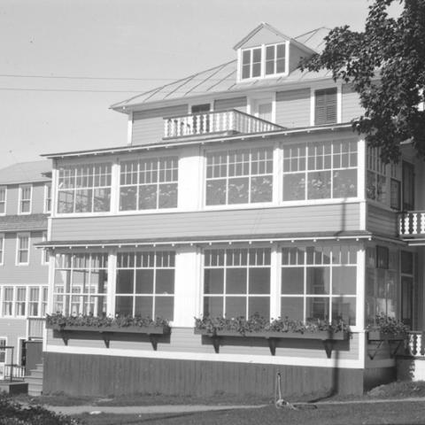 A hotel with many large windows.