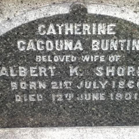 Close-up of a grey tombstone.